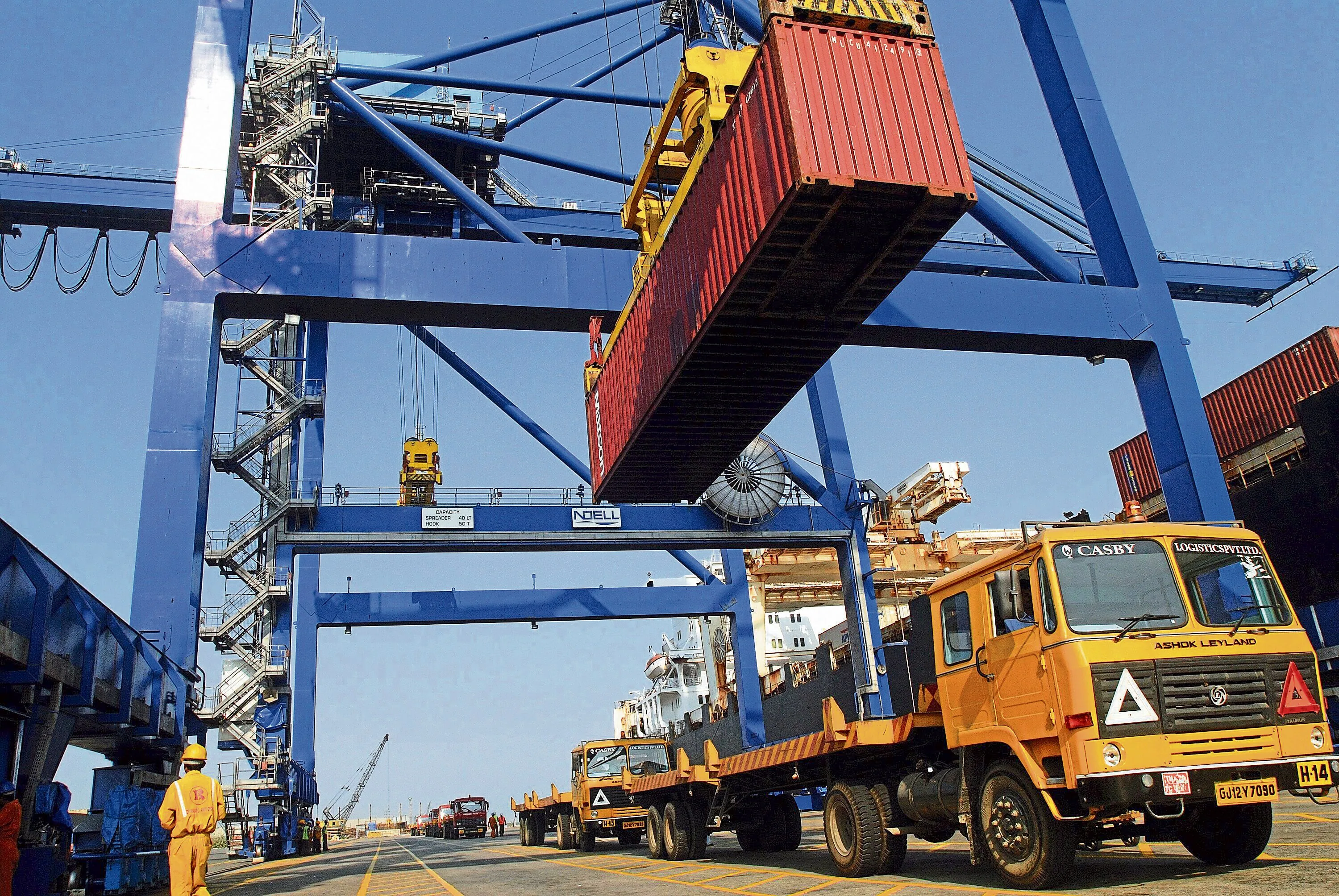 Gantry crane loading a shipping container onto a truck at Mundra port, Gujarat